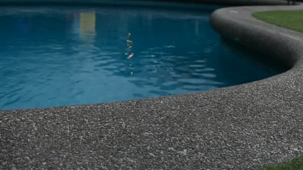 Swimming pool with sandstone and grass floor — Stock Video