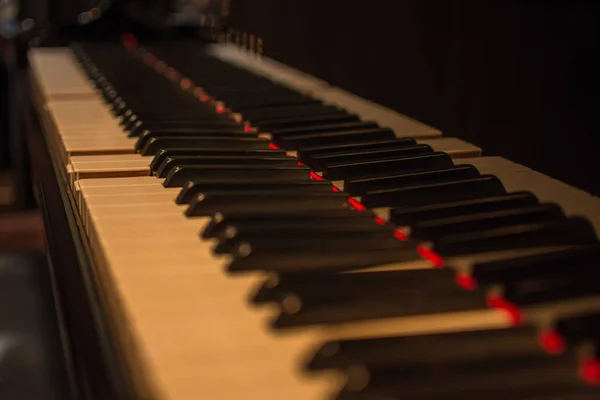 Piano keys on black classical grand piano — Stock Photo, Image