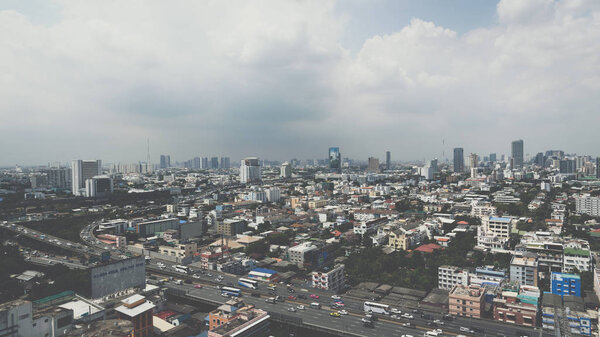 Bangkok, Thailand - April 8, 2017 : Cityscape and transportation with expressway and traffic in daytime from skyscraper of Bangkok. Bangkok is the capital and the most populous city of Thailand.
