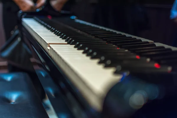 Piano keys on black classical grand piano — Stock Photo, Image