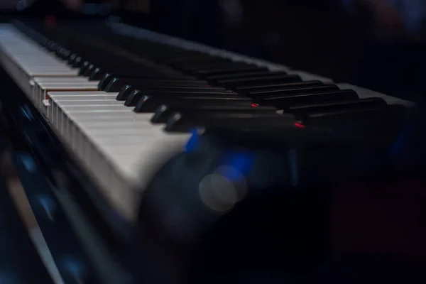 Piano keys on black classical grand piano — Stock Photo, Image