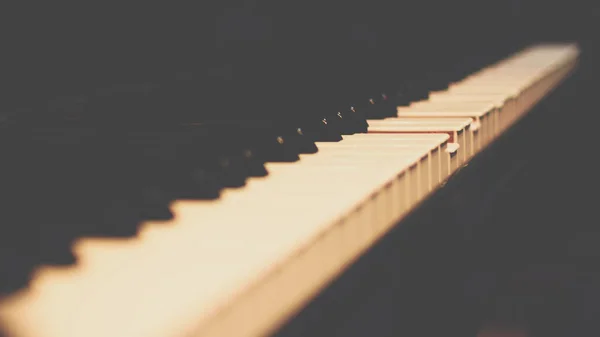 Piano keys on black classical grand piano — Stock Photo, Image