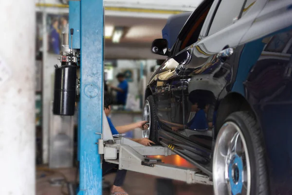 Checking car suspension — Stock Photo, Image