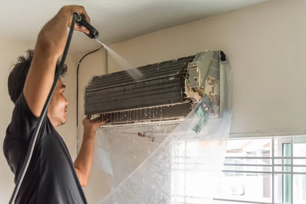 Cleaning air conditioner by water for clean a dust — Stock Photo, Image
