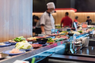 Japan food restaurant belt buffet and chef clipart