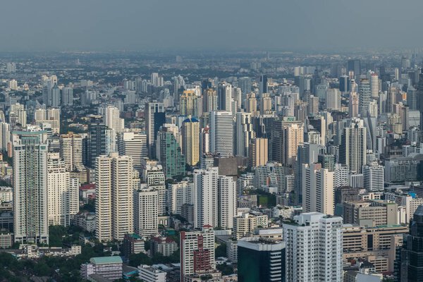 Cityscape and building of city in daytime from skyscraper of Bangkok. Bangkok is the capital and the most populous city of Thailand.