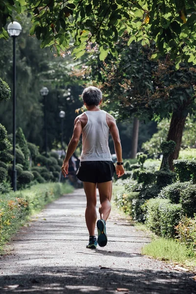 Man jogging run in a outdoor park for exercise