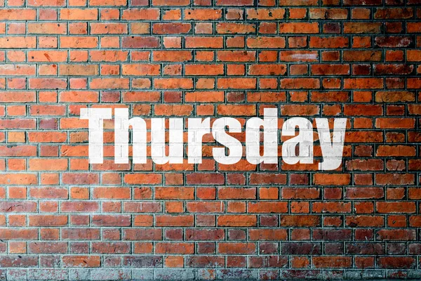 Red Brick wall textur med ett ord torsdag — Stockfoto