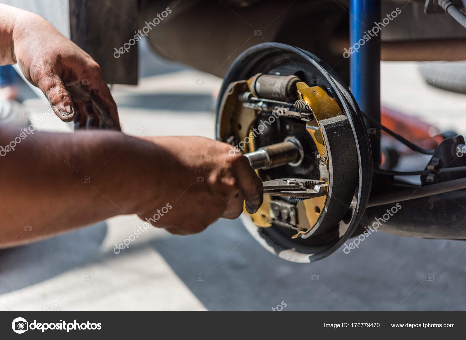 Drum Brake And Asbestos Brake Pads At Car Garage Stock Photo