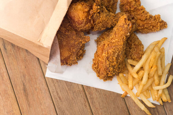 Fried chicken and French fries or chips (potato)