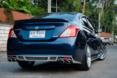 Bangkok, Thailand - January 12, 2020 : Nissan Almera, an ECO car sedan in Thailand, is being posted in one of Thailand magazine to promote that ECO car can be modified into VIP Style. clipart