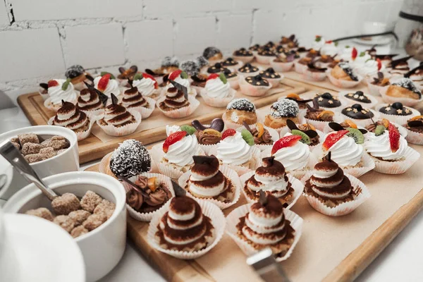 A buffet table. Sweet desserts. Fourchette at the party. Sweet buffet at the party.