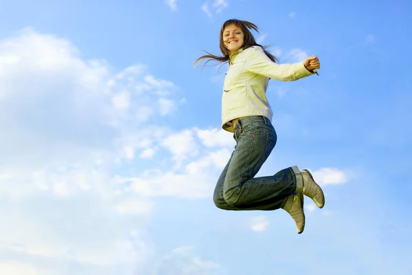 Girl jumping, blue sky — Stock Photo, Image