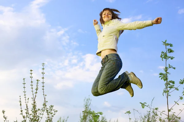 Girl jumping, blue sky — Stock Photo, Image