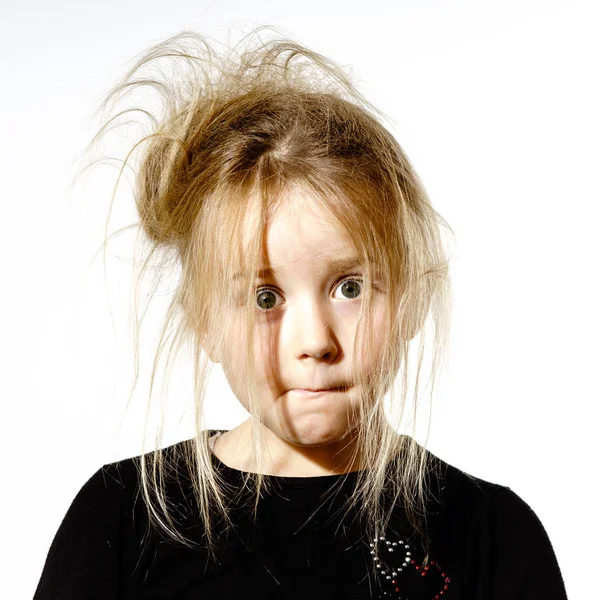 Disheveled preschooler girl with stupid face — Stock Photo, Image