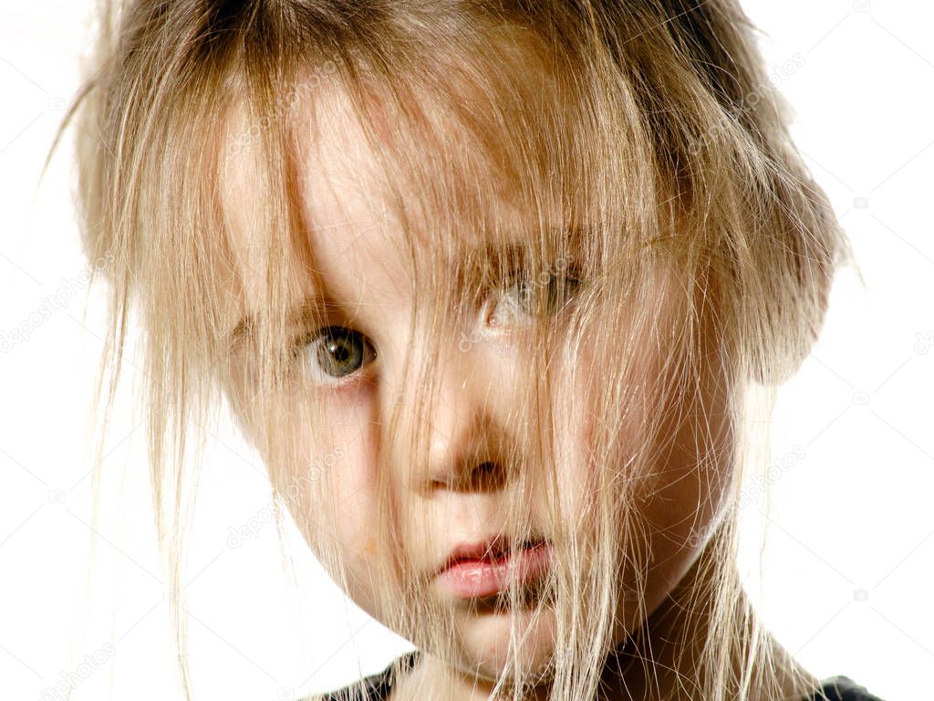 Disheveled preschooler girl with long hair portrait
