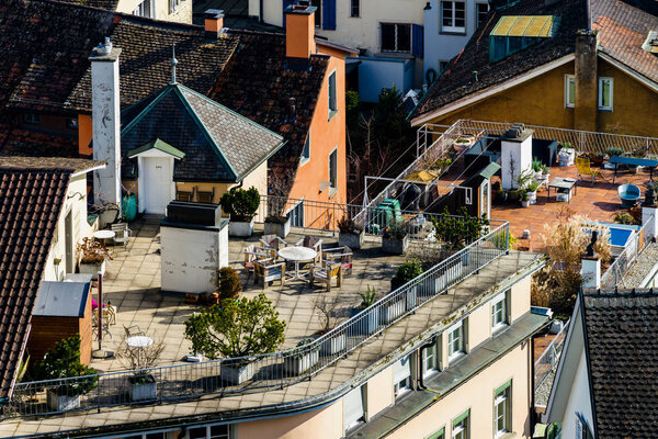 Using of city roofs in Zurich, terrace and gardens, Switzerland