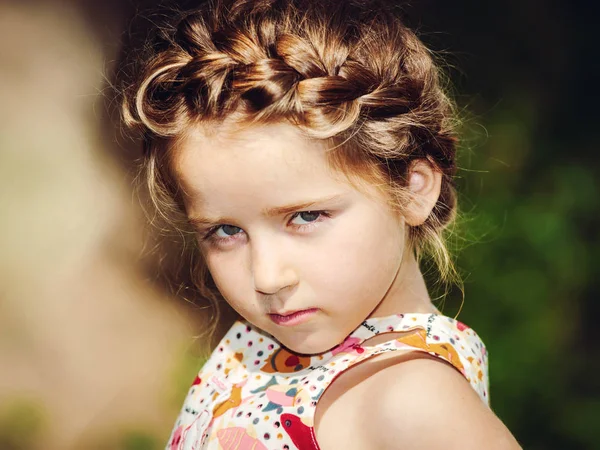 Cute little preschooler girl natural portrait on the sun — Stock Photo, Image