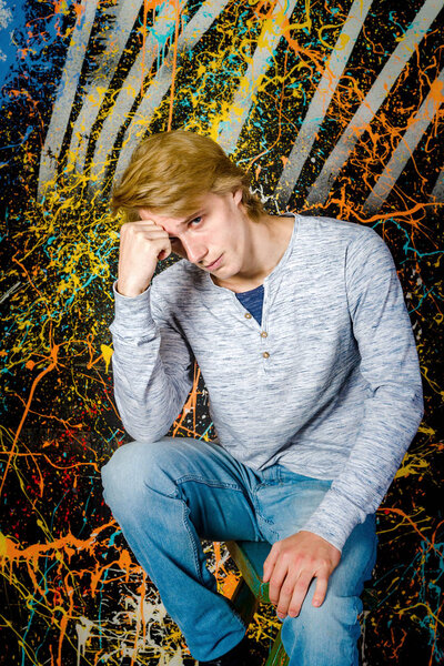 Young attractive guy posing in studio