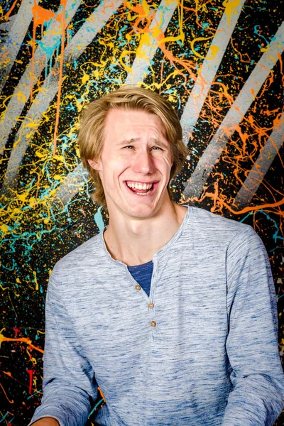 Young attractive guy posing in studio — Stock Photo, Image