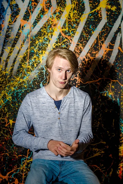 Young attractive guy posing in studio — Stock Photo, Image