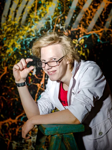 Funny teenage boy posing like a crazy professor or student — Stock Photo, Image