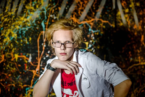 Funny teenage boy posing like a crazy professor or student — Stock Photo, Image