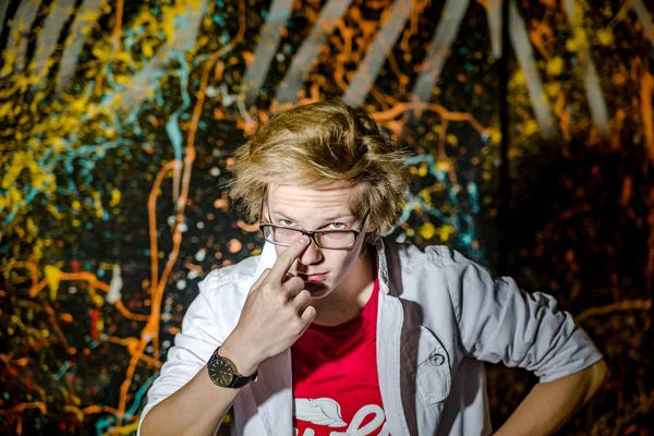 Funny teenage boy posing like a crazy professor or student — Stock Photo, Image