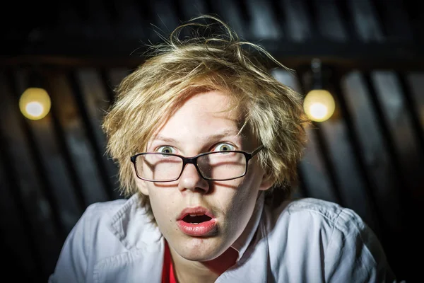 Funny teenage boy posing like a crazy professor or student — Stock Photo, Image