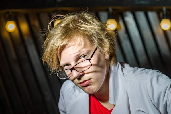 Funny teenage boy posing like a crazy professor or student — Stock Photo, Image