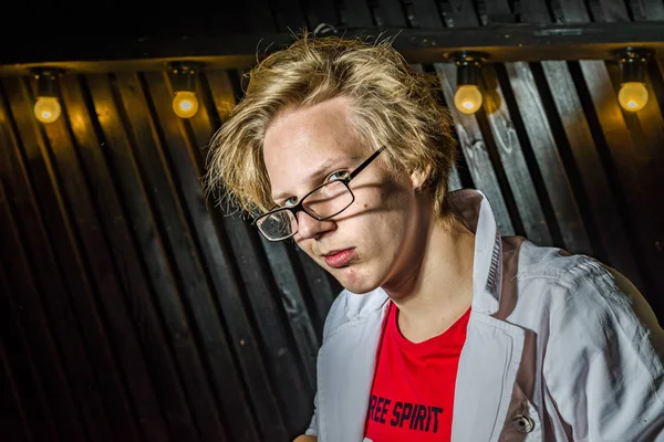 Funny teenage boy posing like a crazy professor or student — Stock Photo, Image