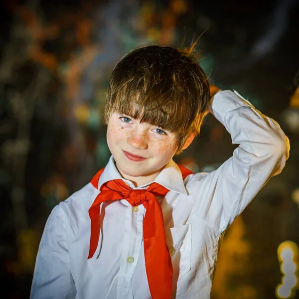 Redhead attractive boy dressed like soviet pioneer with red tie — Stock Photo, Image
