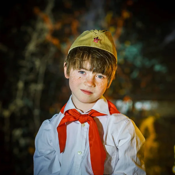 Redhead attractive boy dressed like soviet pioneer with red tie — Stock Photo, Image