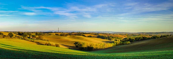 Beautiful green and yellow hills sunset panoramic view with shad — Stock Photo, Image