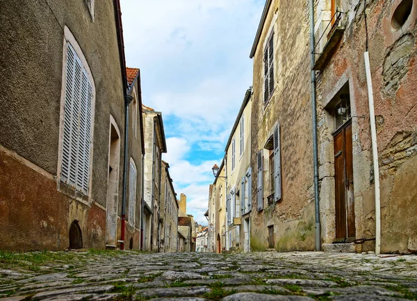 Old medieval houses on the cobbled street in ancient french vill Stock Image