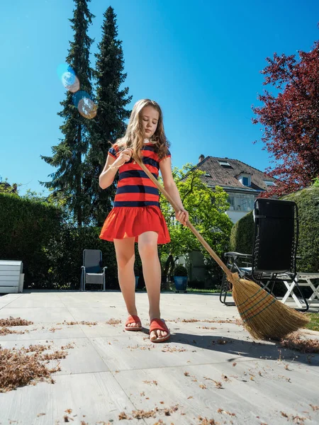 Schoolgirl Poses Broom Her Mothers Shoes Yard Sweeping Garden Sunny — Stock Photo, Image