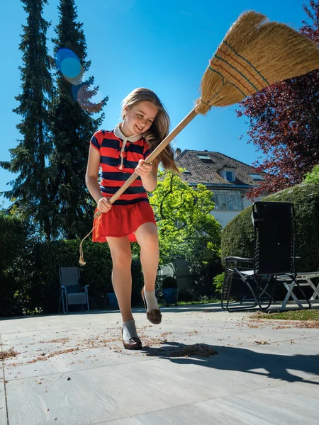 Schoolgirl Poses Broom Her Mothers Shoes Yard Sweeping Garden Sunny — Stock Photo, Image