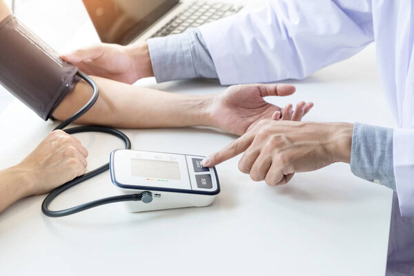 healthcare, hospital and medicine concept - doctor and patient m