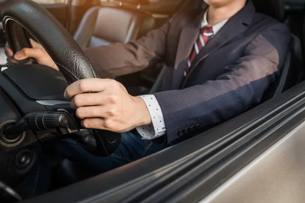 Portrait of a young handsome businessman driving a luxury sports — Stock Photo, Image