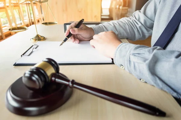 Lawyer hand writes the document — Stock Photo, Image