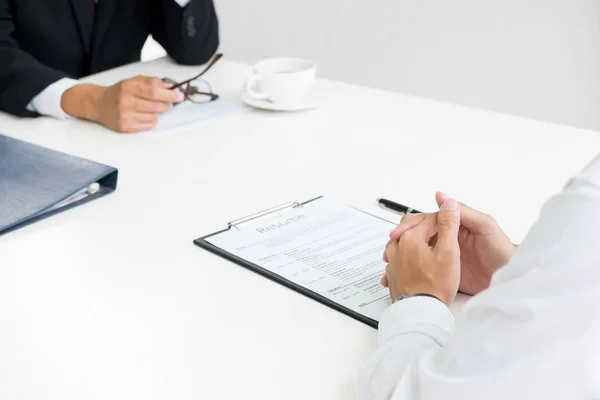 Businessman conducting an interview with businessman in an offic — Stock Photo, Image