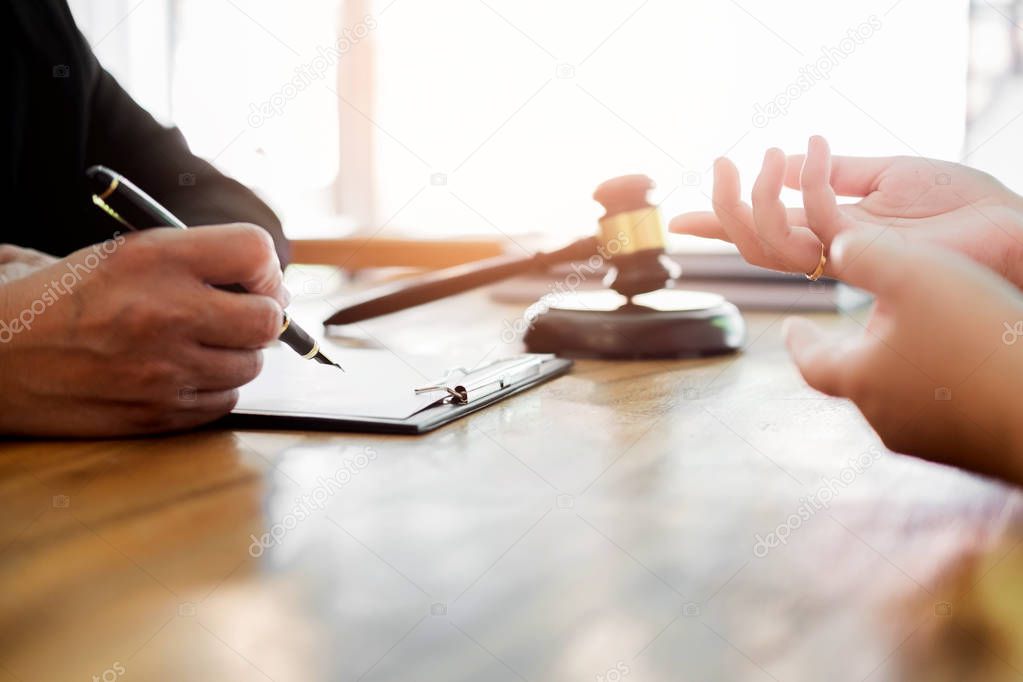 business people and lawyers discussing contract papers sitting a