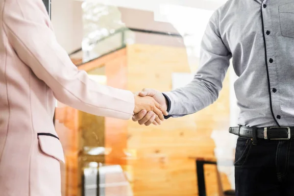Two confident business man shaking hands during a meeting in the — Stock Photo, Image