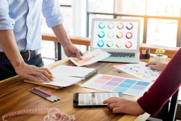 Two young men working as fashion designers and drawing sketches — Stock Photo, Image