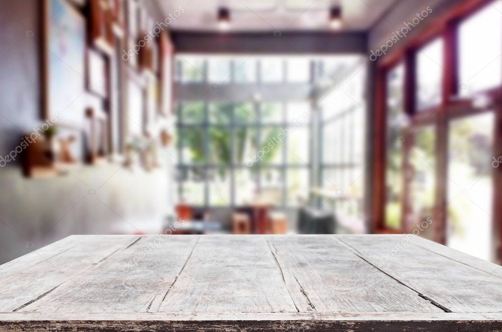 Selected focus empty brown wooden table and Coffee shop or resta