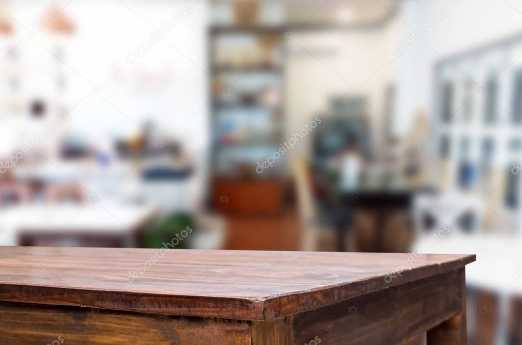 Selected focus empty brown wooden table and Coffee shop or resta