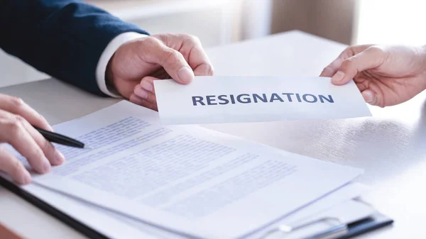 Employee businessman submit or sending resignation document letter to human resource manager or boss, Change of job, unemployment, resign concept