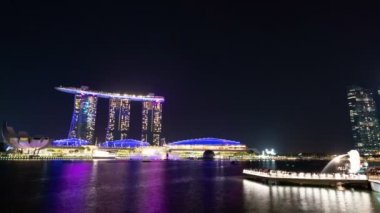 Singapore city, Singapore-  4 August 2019: 4K time lapse video of night cityscape Marina Bay business financial district, light reflected on the harbour