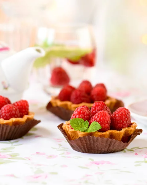 Cupcake with raspberries, mint on a table — Stock Photo, Image