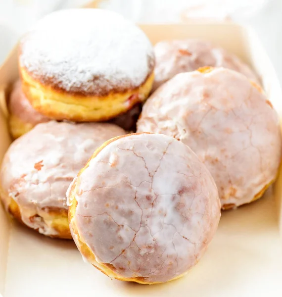 Many donuts on a white box — Stock Photo, Image